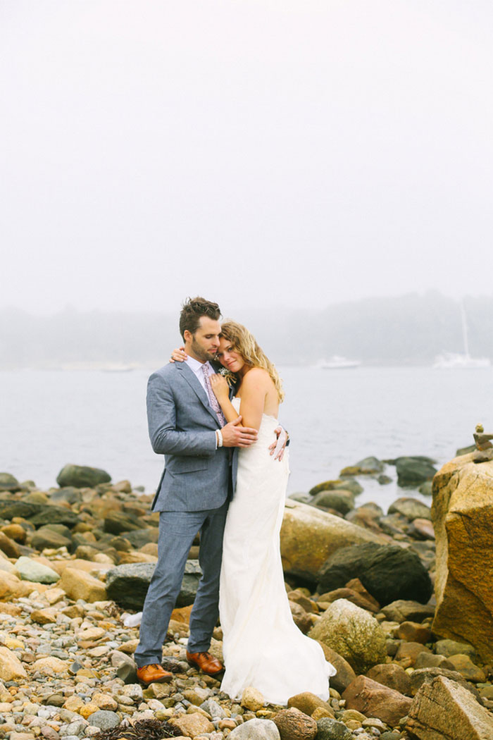 bride and and groom portrait by the sea