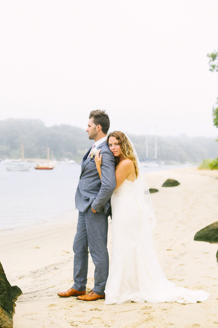 bride and and groom portrait by the sea