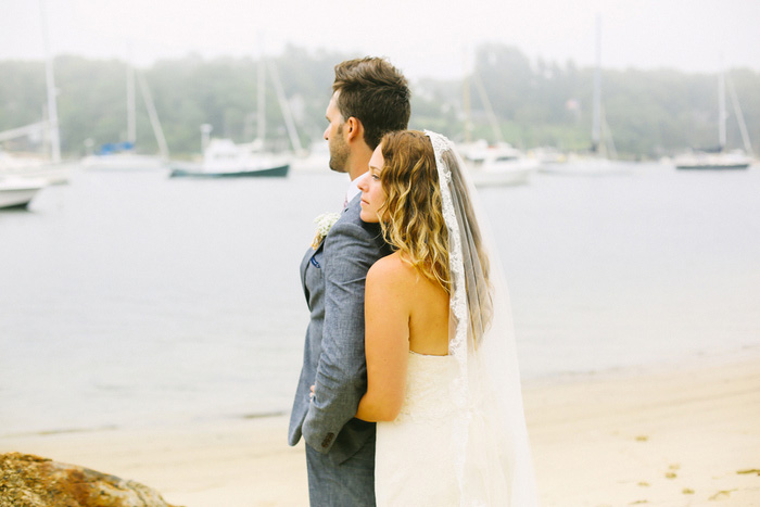 bride and and groom portrait by the sea