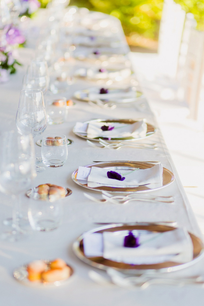 table setting with purple flowers