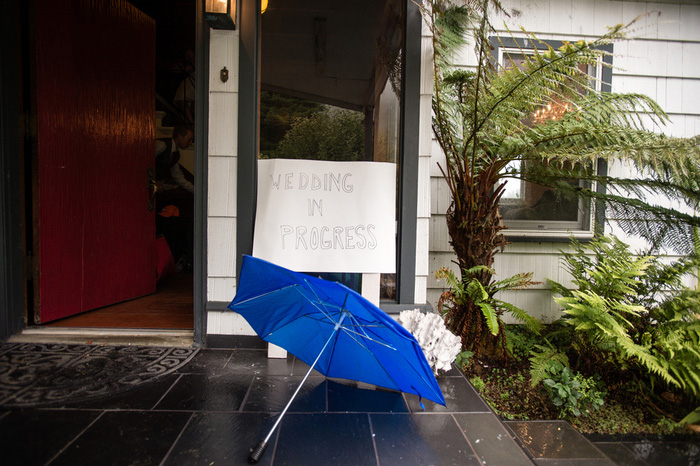 blue umbrella on wet porch