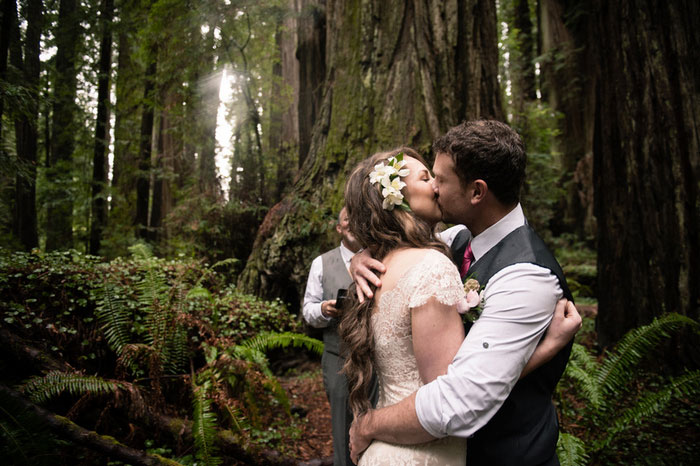 bride and groom first kiss