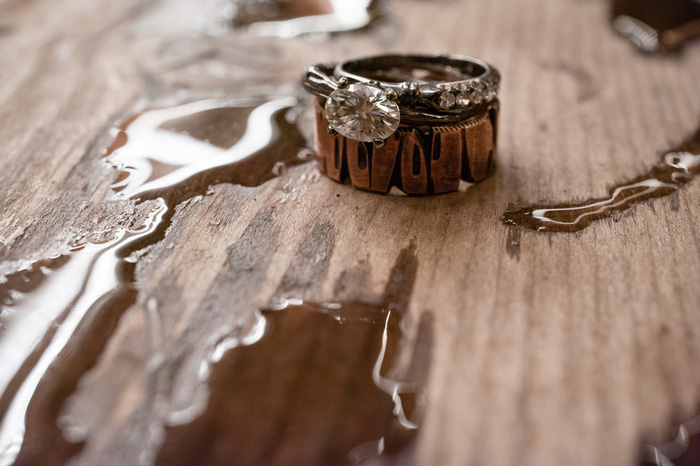 wedding rings on wet wood