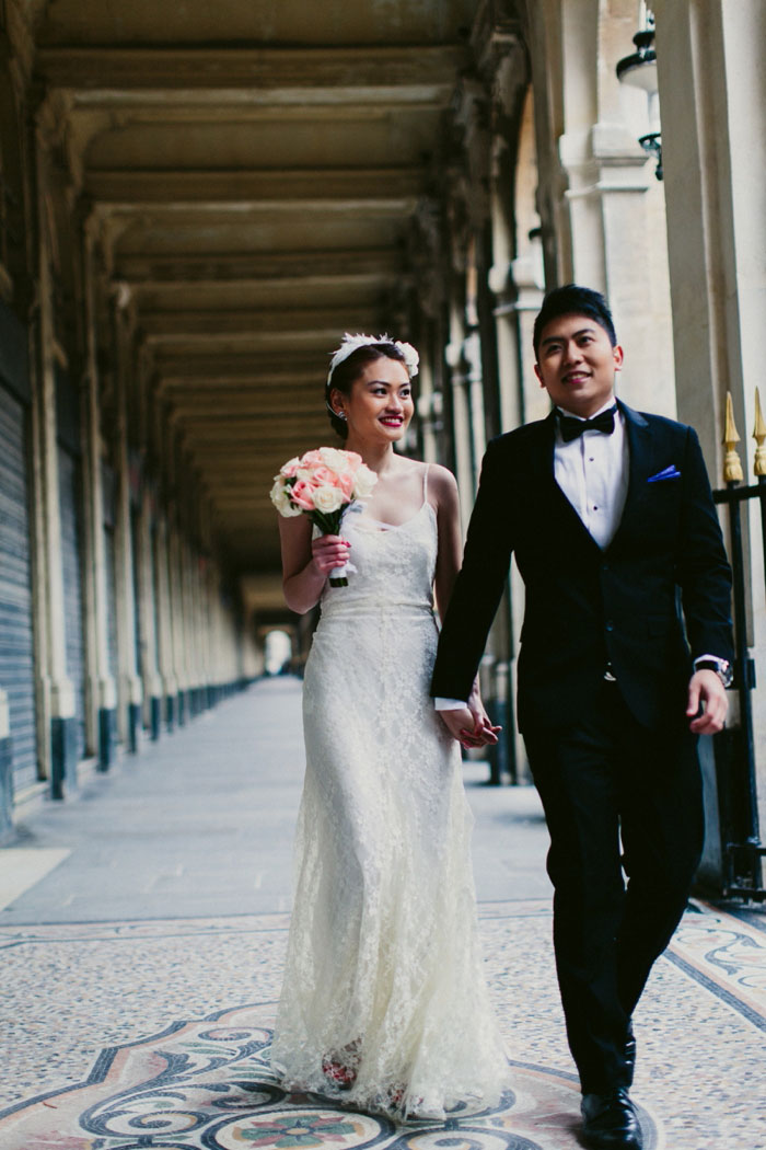 bride and groom walking in Paris