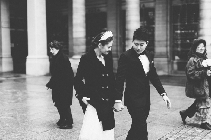 bride and groom walking in Paris