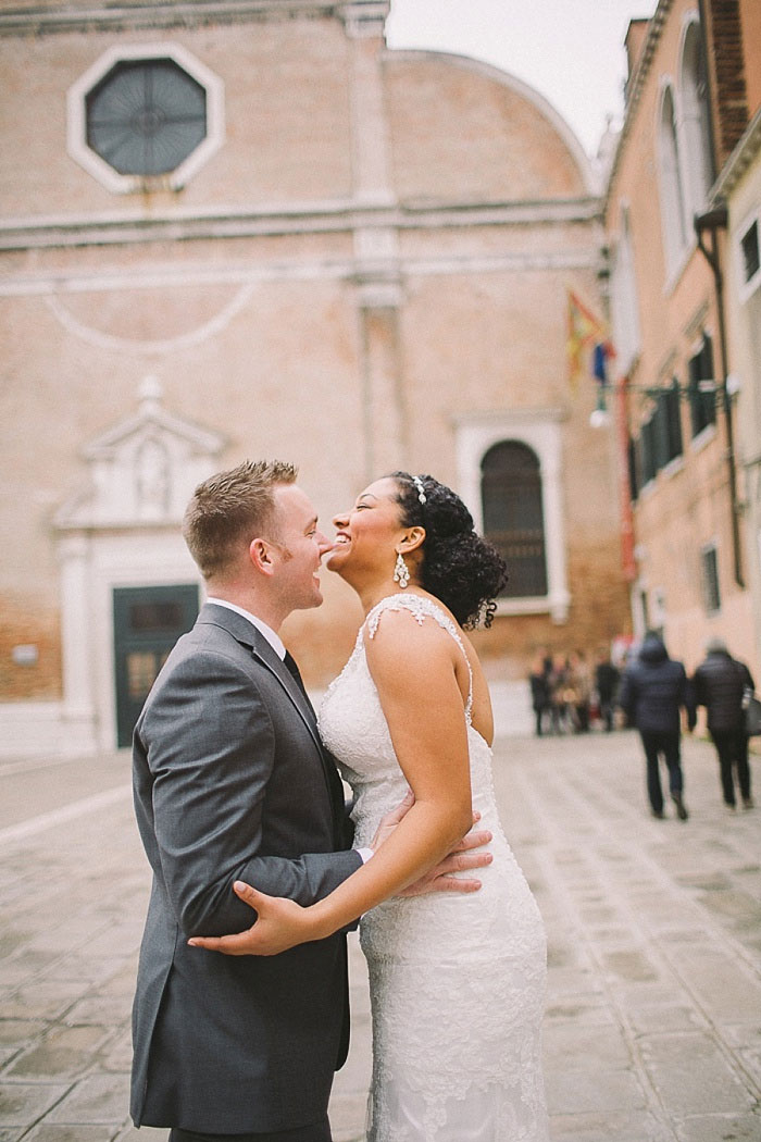 bride and groom laughing in Venice