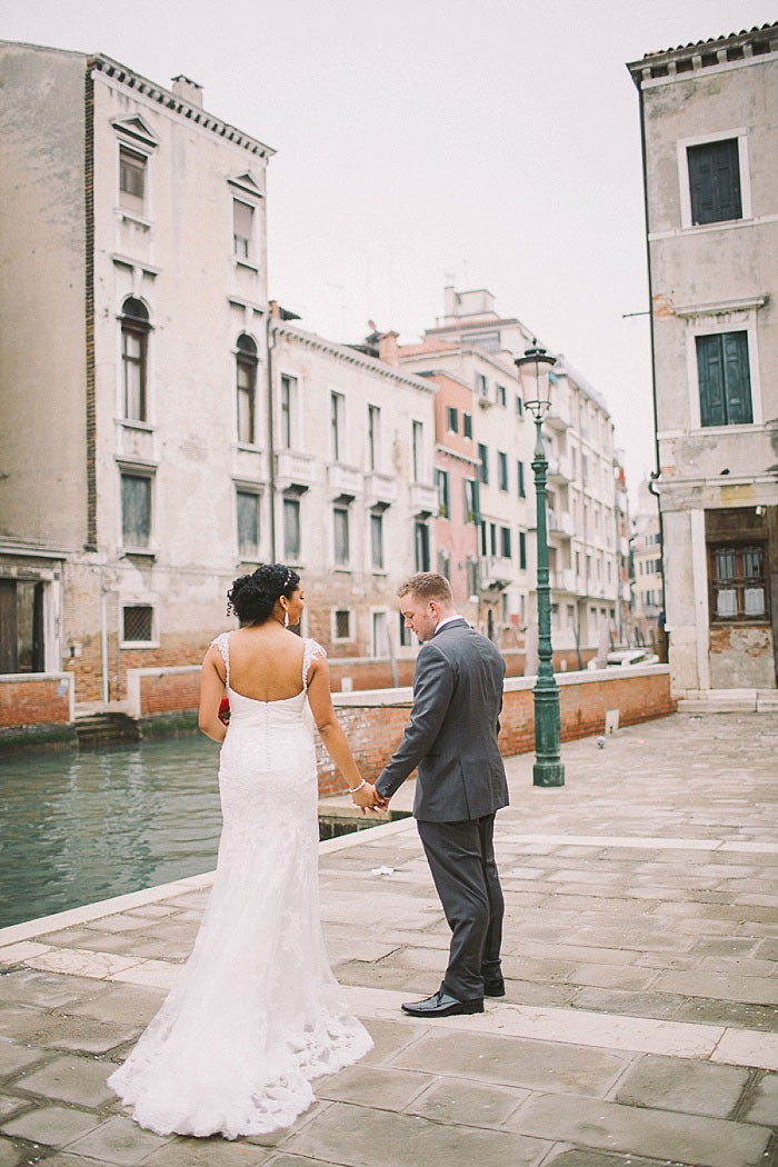 bride and groom by the canals in Venice