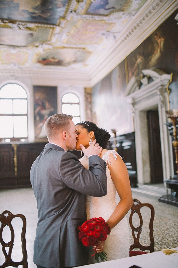 bride and groom first kiss