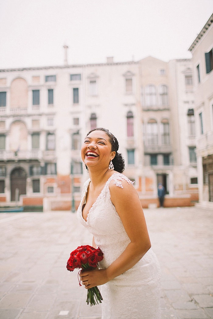 bride laughing in Venice square