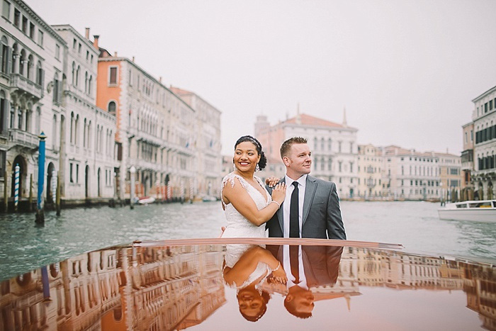 bride and groom in boat on Venice canal