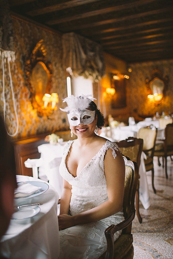 bride wearing masquerade mask