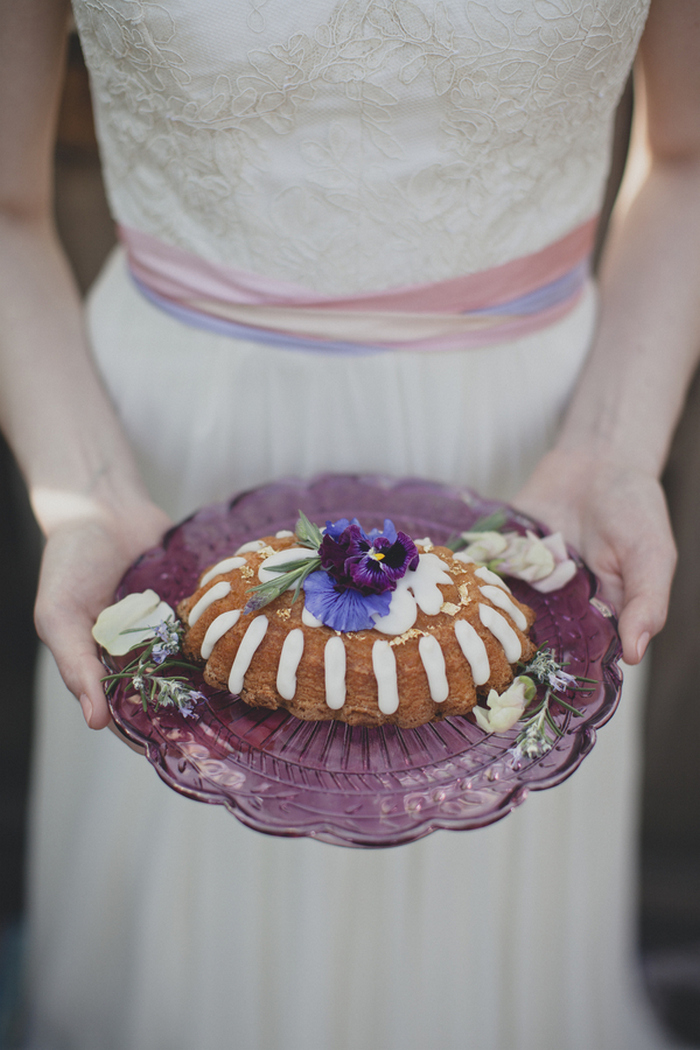 bride holding cake