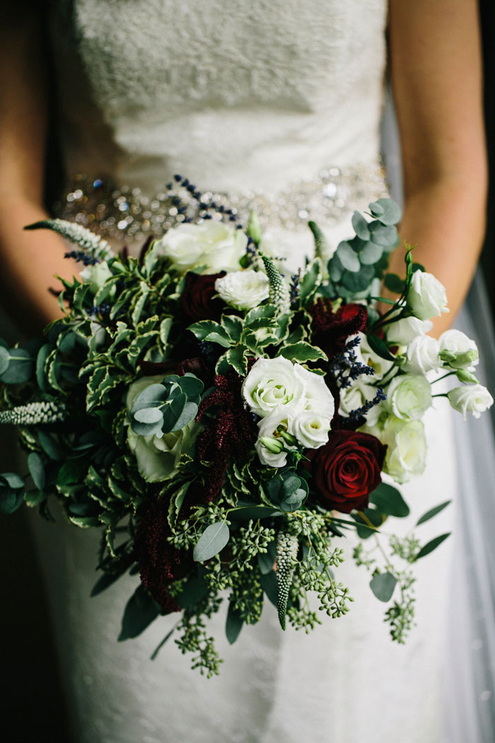 white, green, and red wedding bouquet