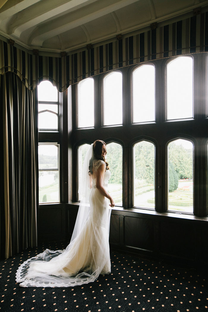 bride portrait looking out windows