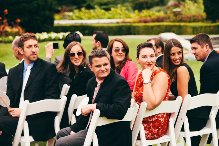 guests watching bride walk down the aisle