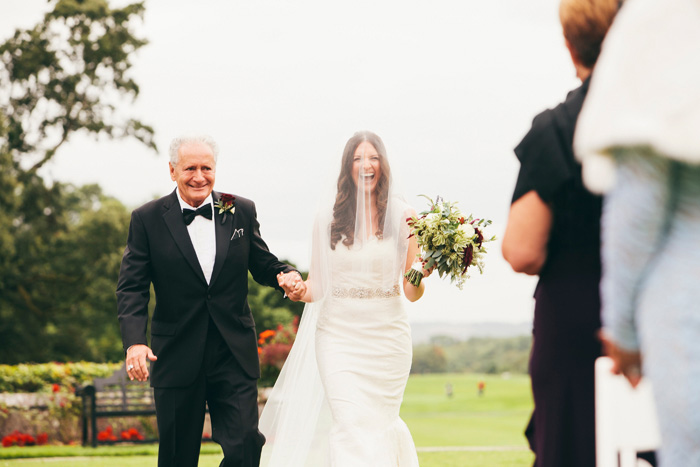 bride excited to be walking down the aisle