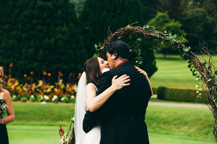 bride and groom first kiss