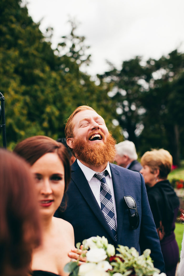 laughing wedding guest