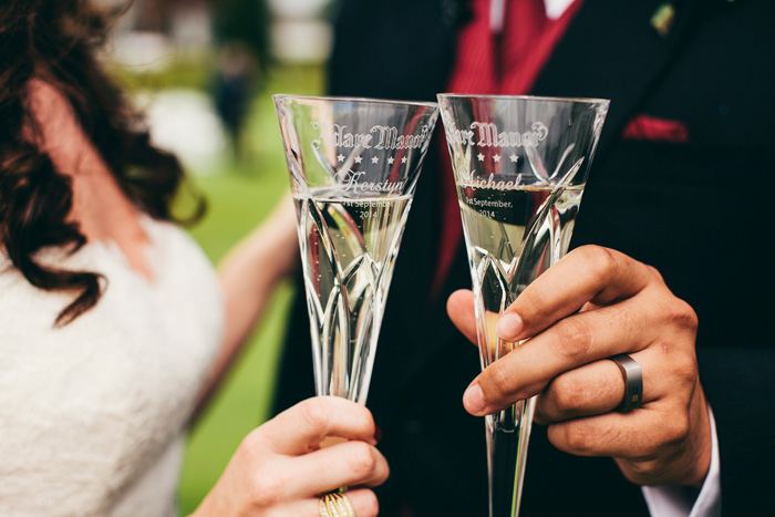 bride and groom holding champagne flutes