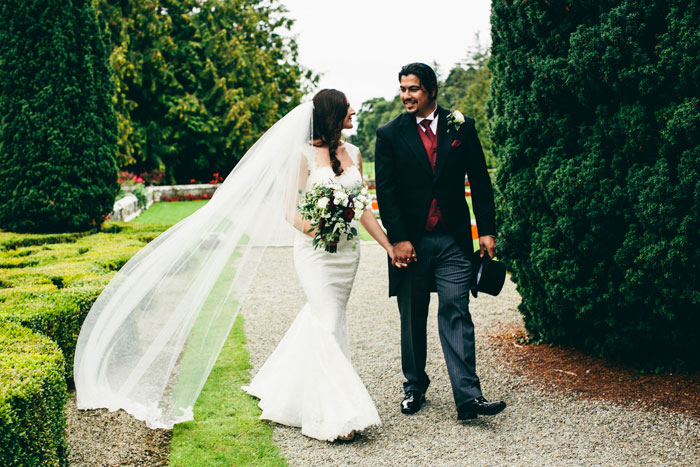 bride and groom walking on Irish Manor grounds