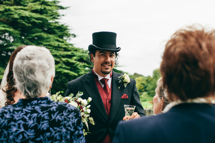 groom speaking with guests