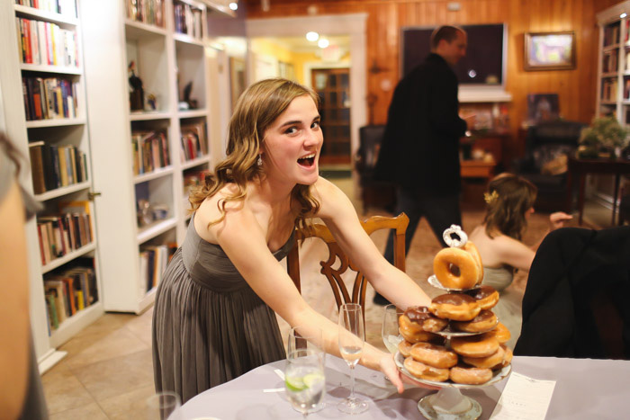 bridesmaid putting out donuts