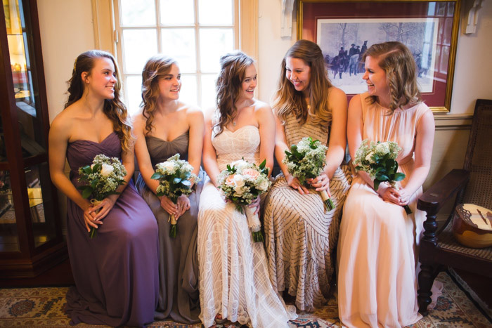 bride sitting with her bridesmaids