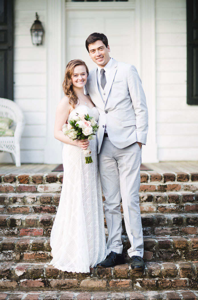 bride and groom portrait in front of plantation