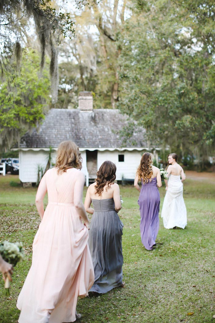 bride heading to ceremony with her bridesmaids