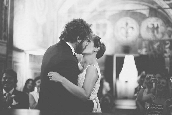 bride and groom first kiss