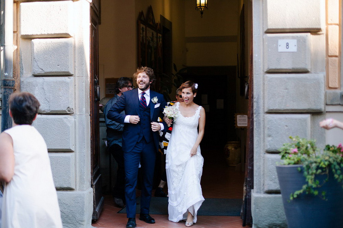 bride and groom exitingthe church