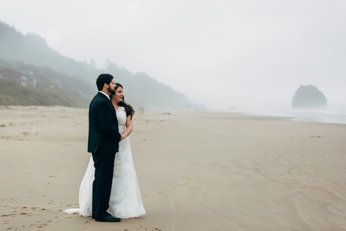 bride and groom portrait on foggy beach