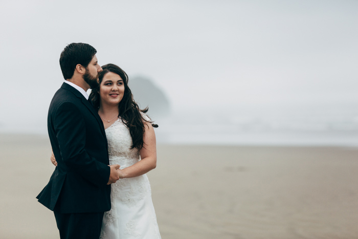 bride and groom portrait on foggy beach