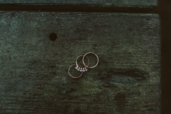 wedding rings on wood plank