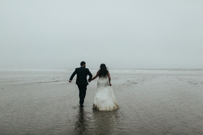 bride and groom on foggy Oregon beach