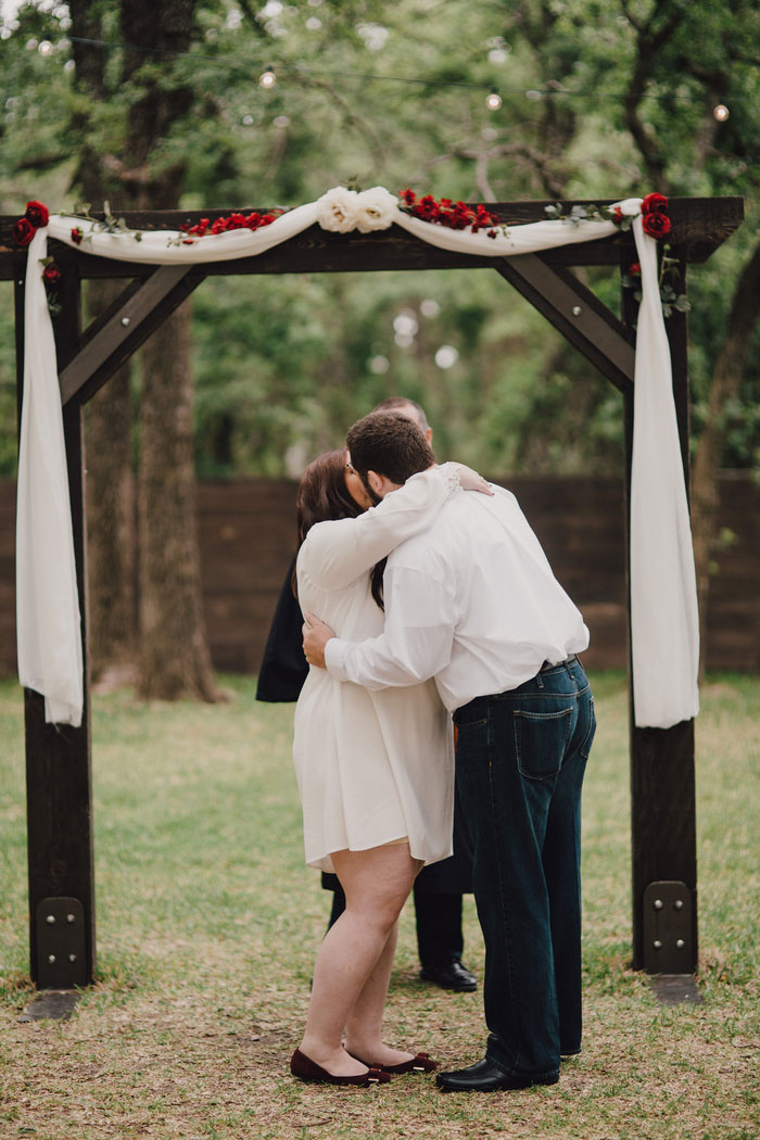 bride and groom first kiss