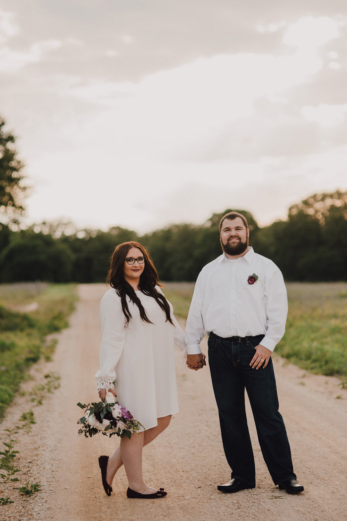 bride and groom portrait on dirt road