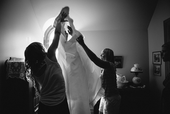 bride getting her dress on