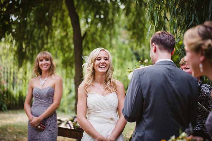 bride laughing during ceremony