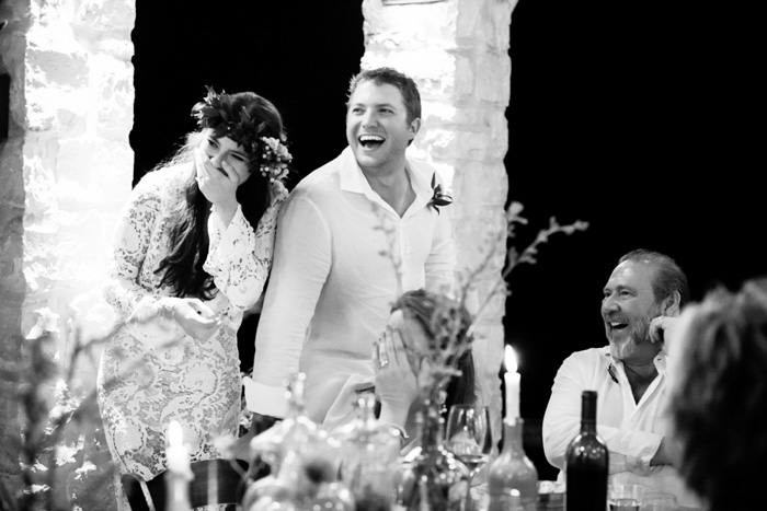 bride and groom laughing at reception