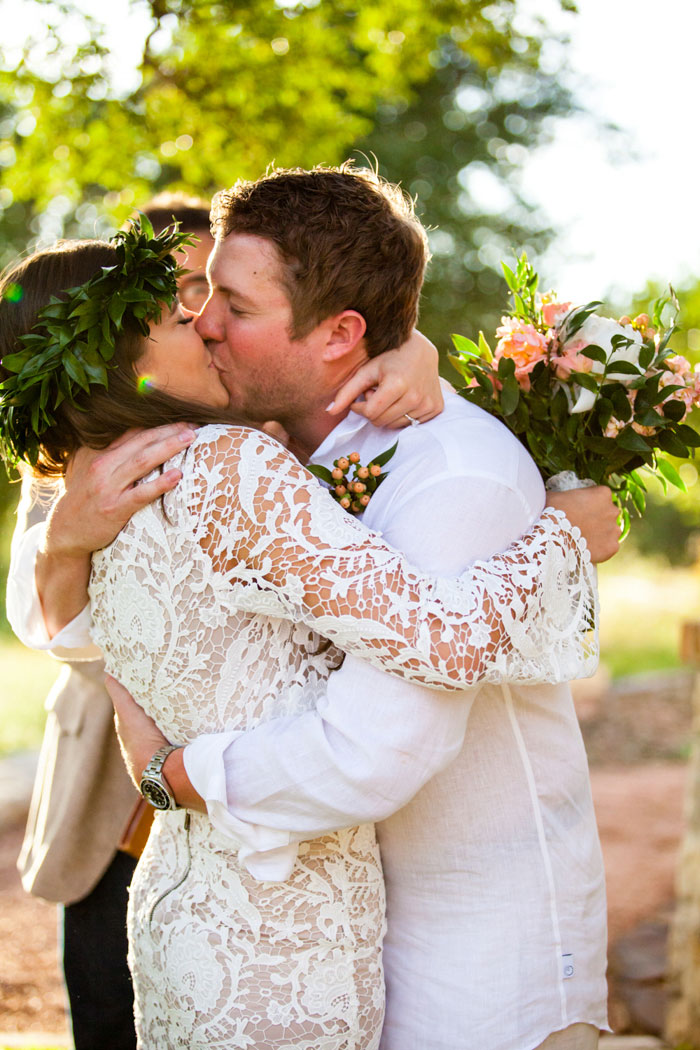 bride and groom first kiss