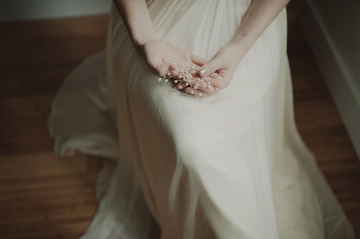 bride holding hairpiece