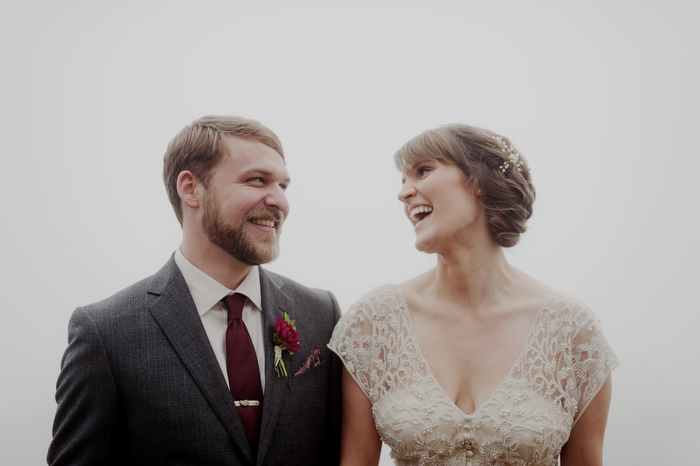 bride and groom laughing