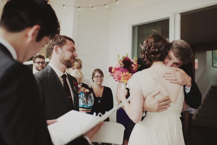 bride hugging father at altar