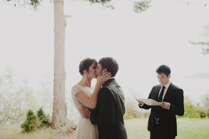 bride and groom first kiss