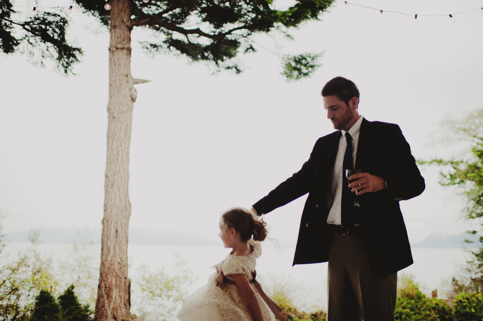 groom twirling flower girl