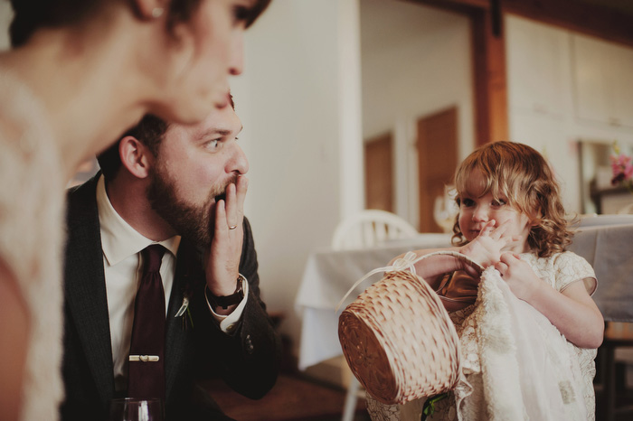 bride and groom with flower girl