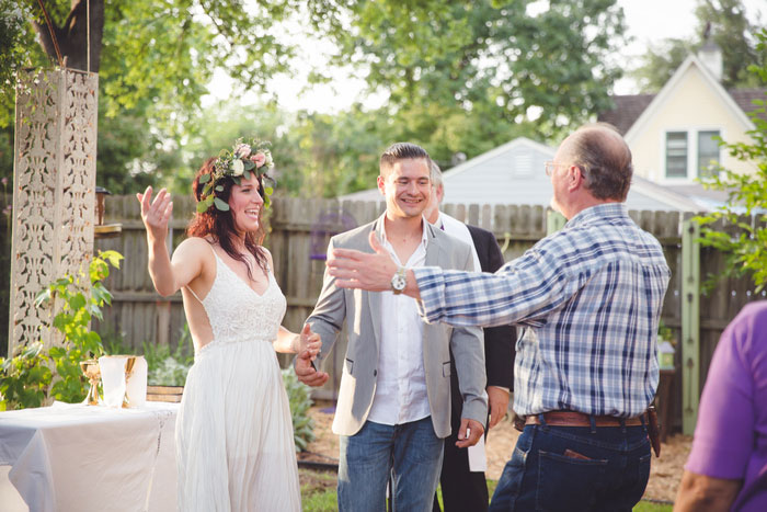 bride going to hug wedding guest