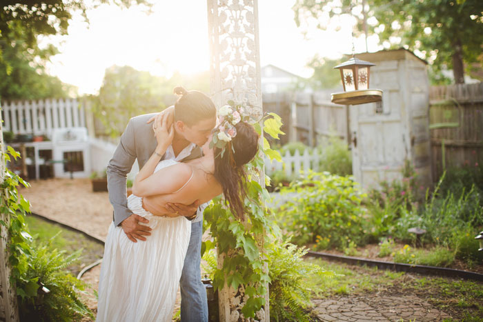 groom dipping bride and kissing her