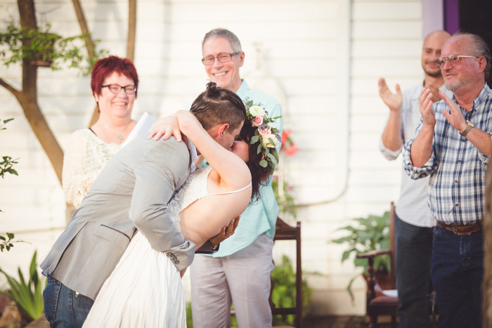 bride and groom first kiss